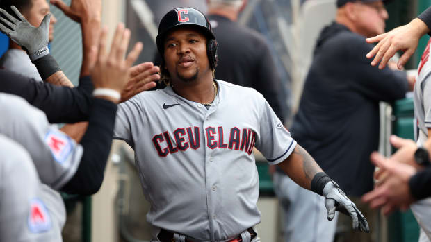 Sep 9, 2023; Anaheim, California, USA; Cleveland Guardians designated hitter Jose Ramirez (11) is greeted in the dugout after hitting a home run during the first inning against the Los Angeles Angels at Angel Stadium.